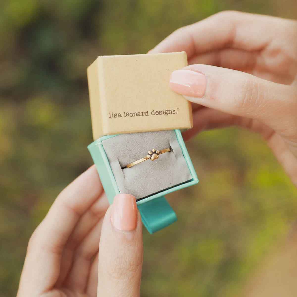 girl wearing 2 Furry Footprint Dainty Rings