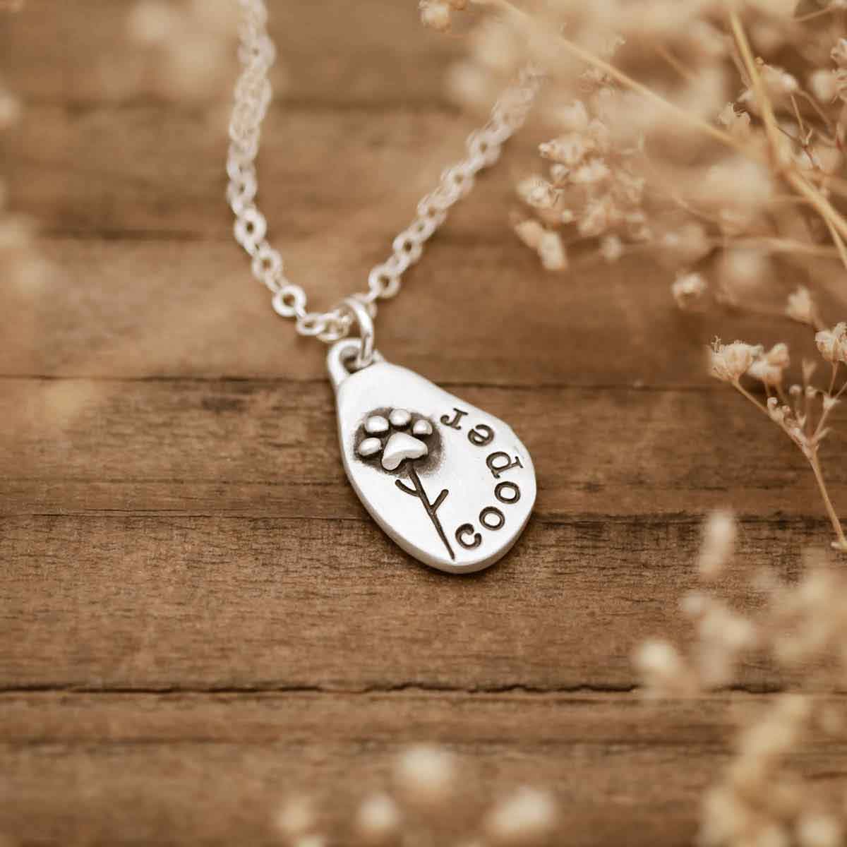 girl wearing a personalized Furry Footprint Flower Necklace