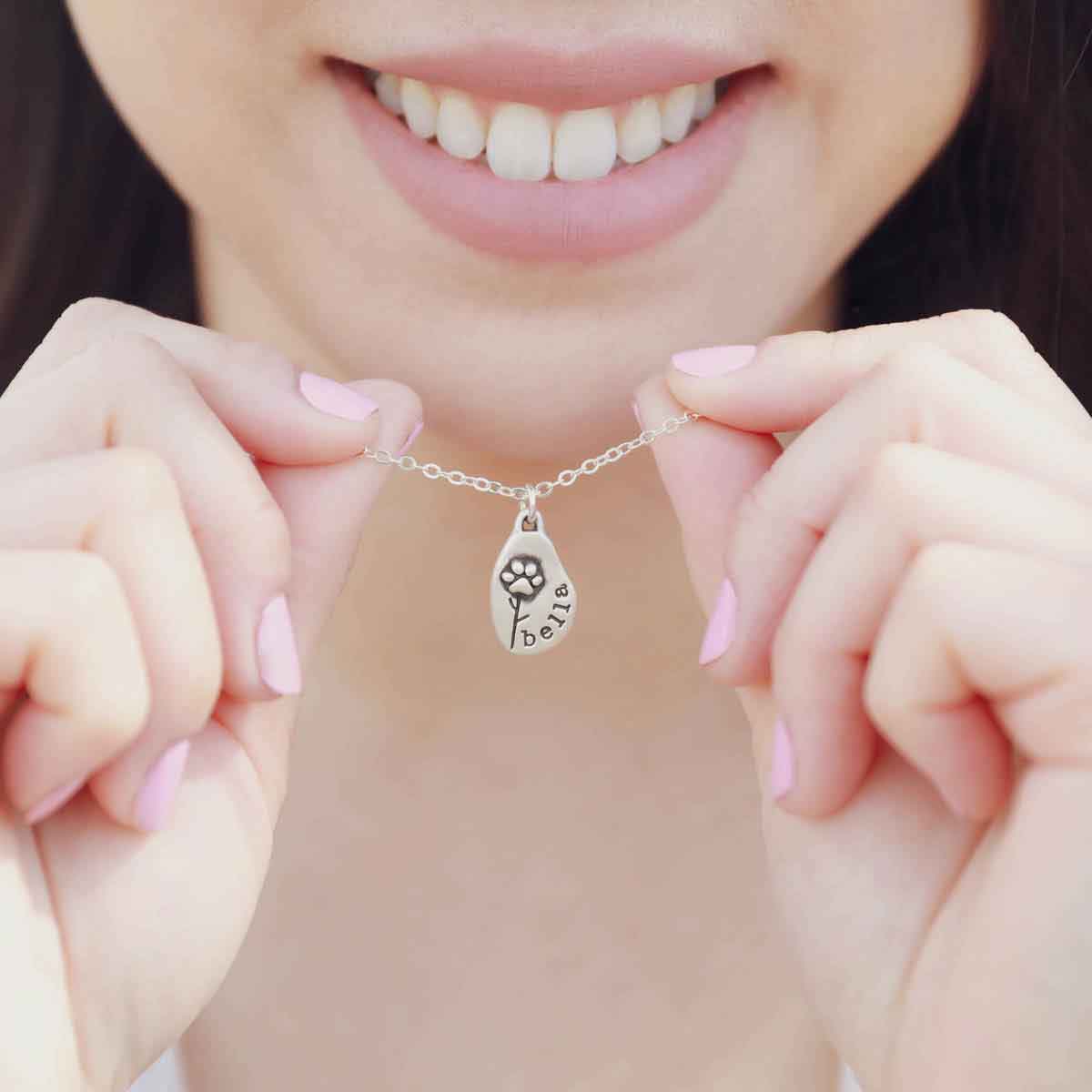 girl wearing a personalized Furry Footprint Flower Necklace