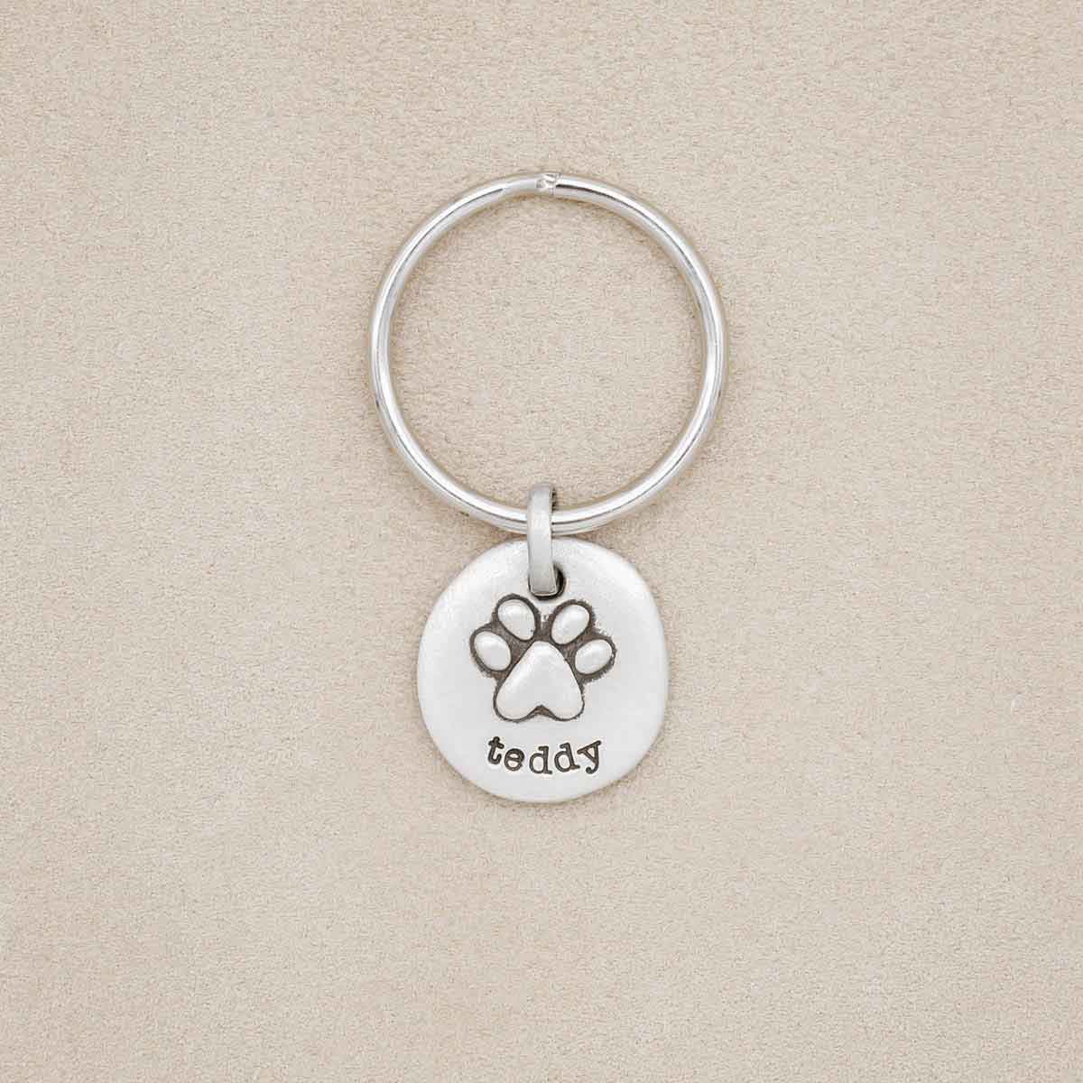 Furry Footprint keychain, handcrafted in sterling silver, personalized with pet's name