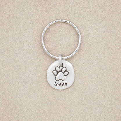 Furry Footprint keychain, handcrafted in sterling silver, personalized with pet's name