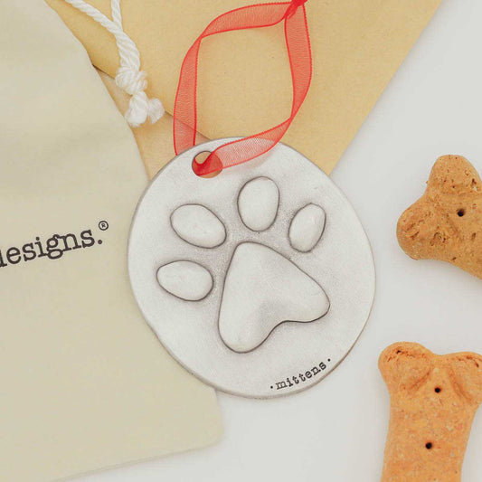 furry footprint ornament hand-molded and cast in fine pewter and personalized with a meaningful name, phrase or date