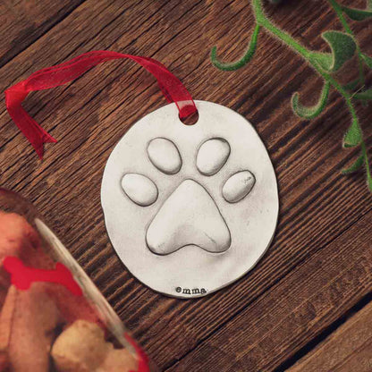 furry footprint ornament hand-molded and cast in fine pewter and personalized with a meaningful name