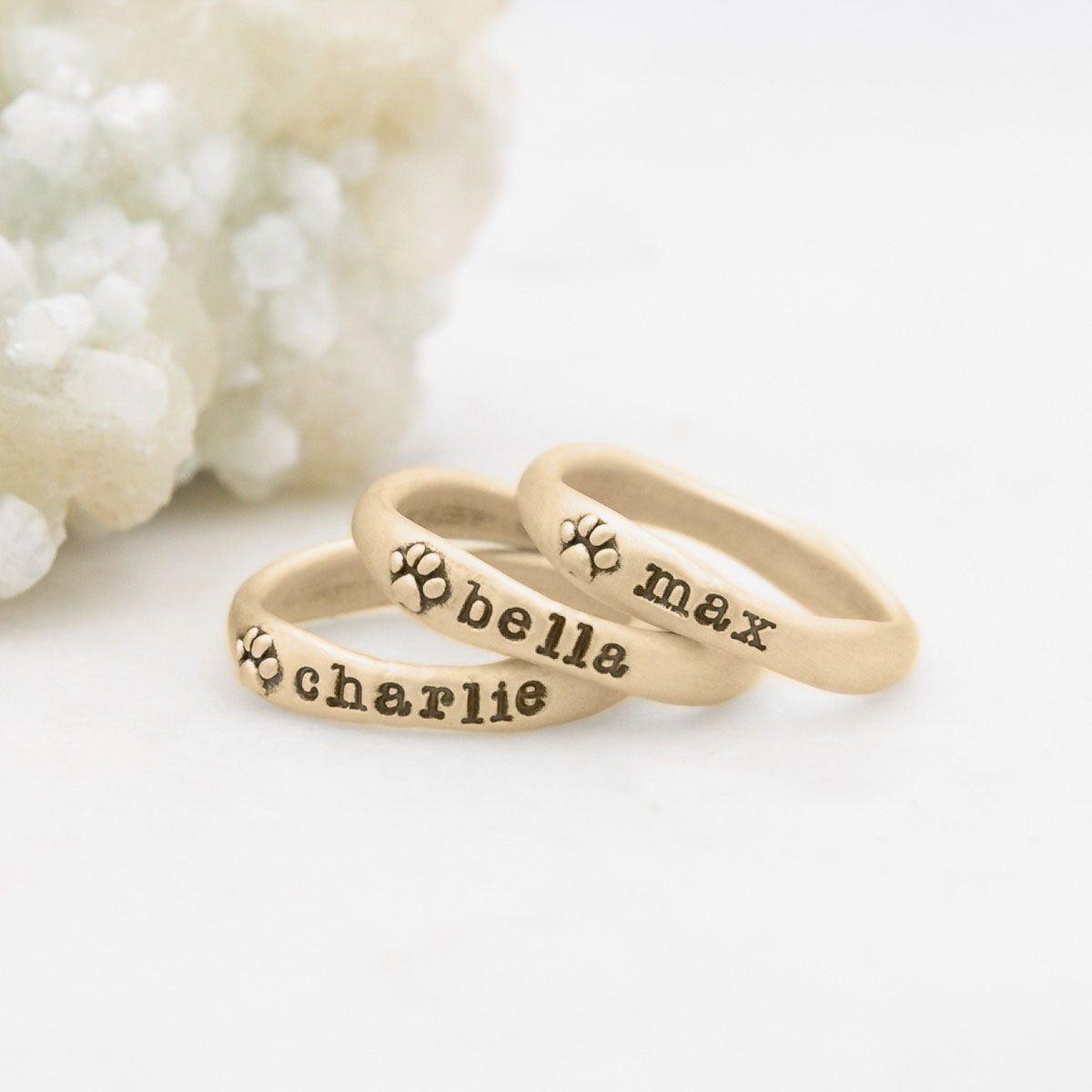 furry footprint 14k yellow gold stacking rings personalized with pet names