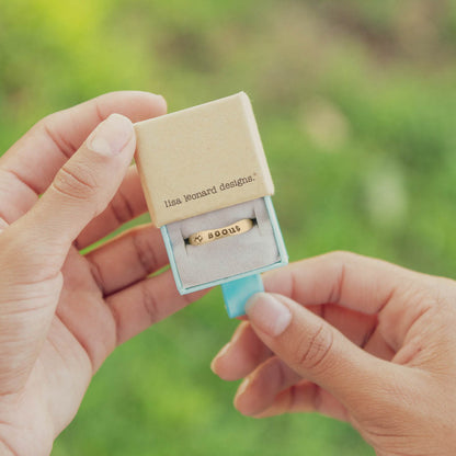 furry footprint 14k yellow gold stacking ring personalized with pet name in original packaging