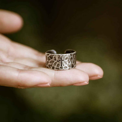 woman wearing a blackened sterling silver Hammered Cross Adjustable Ring