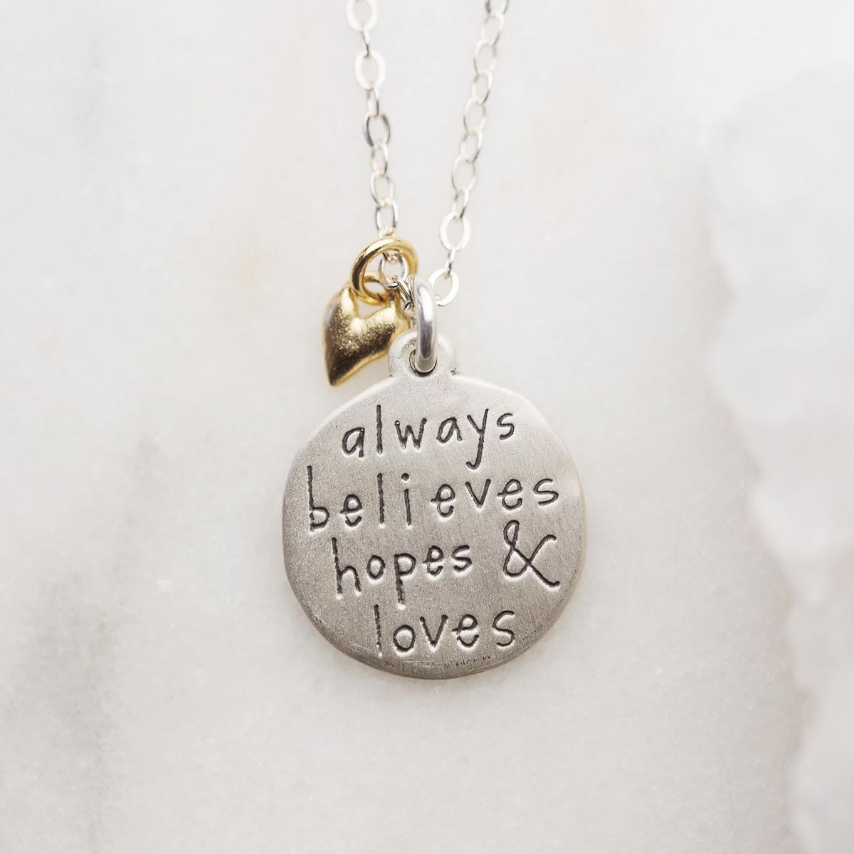 Heart to Heart mom necklace handcrafted in sterling silver engraved and attached with a bronze heart charm