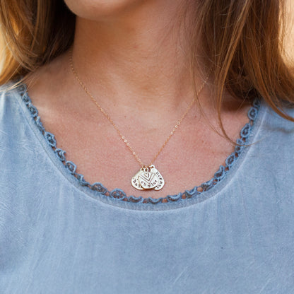 woman wearing her handcrafted 10k yellow gold personalized jumble of love necklace