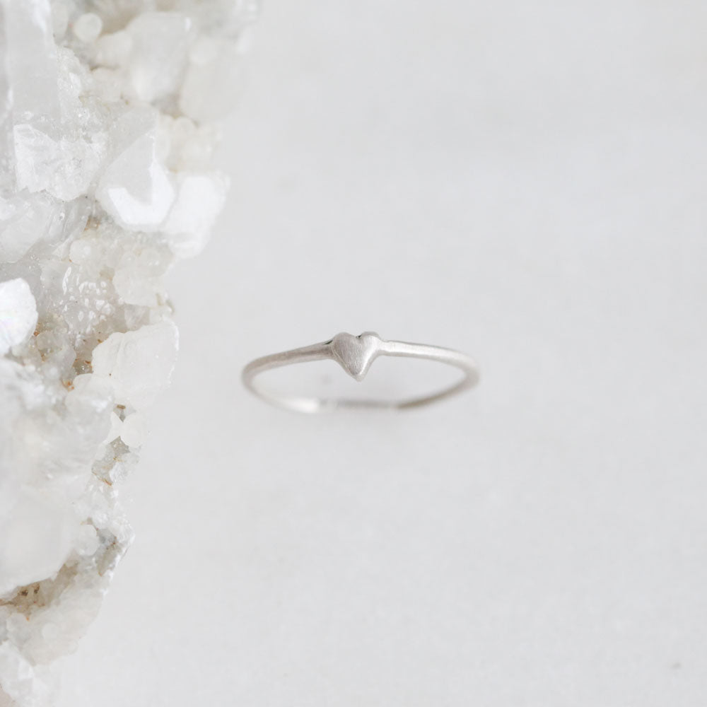 sterling silver sweet love ring - one heart on a marble background