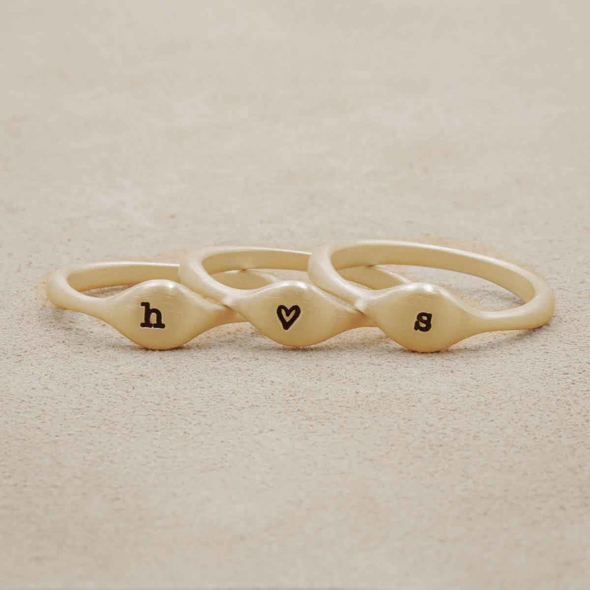 Initial stacking ring handcrafted and cast in 10k yellow gold then hand-stamped with an initial 