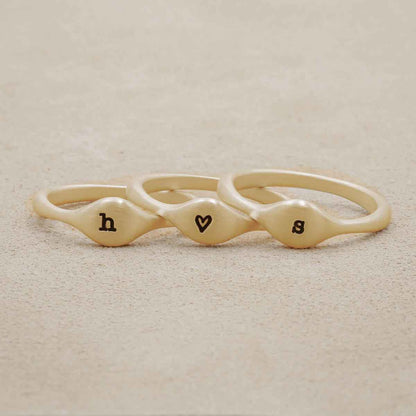 Initial stacking ring handcrafted and cast in 10k yellow gold then hand-stamped with an initial 