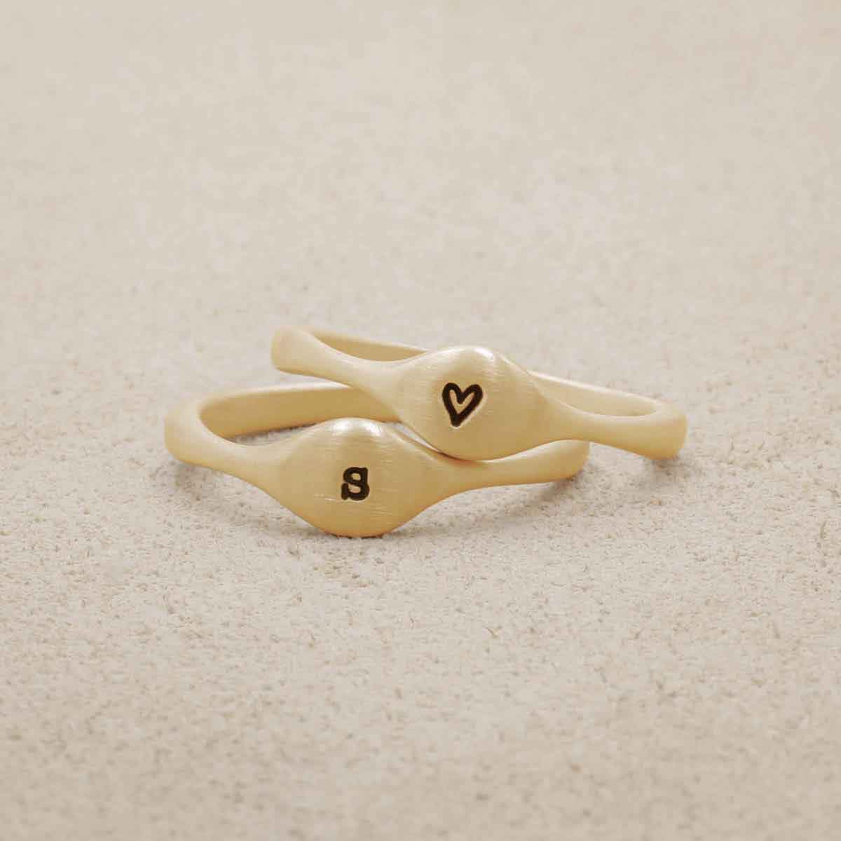 Initial stacking ring handcrafted and cast in 10k yellow gold then hand-stamped with an initial