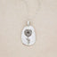 sterling silver January birth flower necklace, on beige background