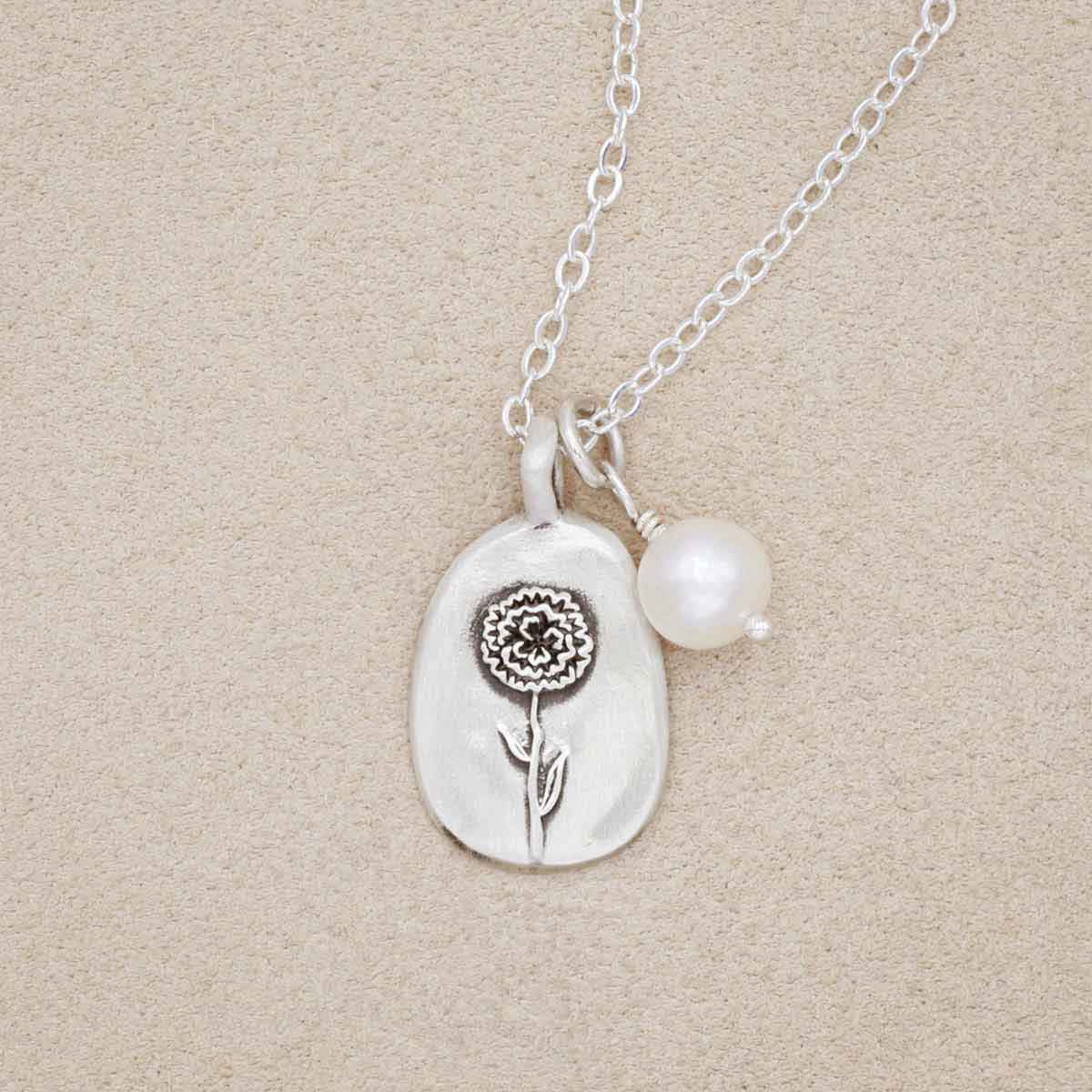 January birth flower necklace handcrafted in sterling silver with a special birth month charm strung with a vintage freshwater pearl