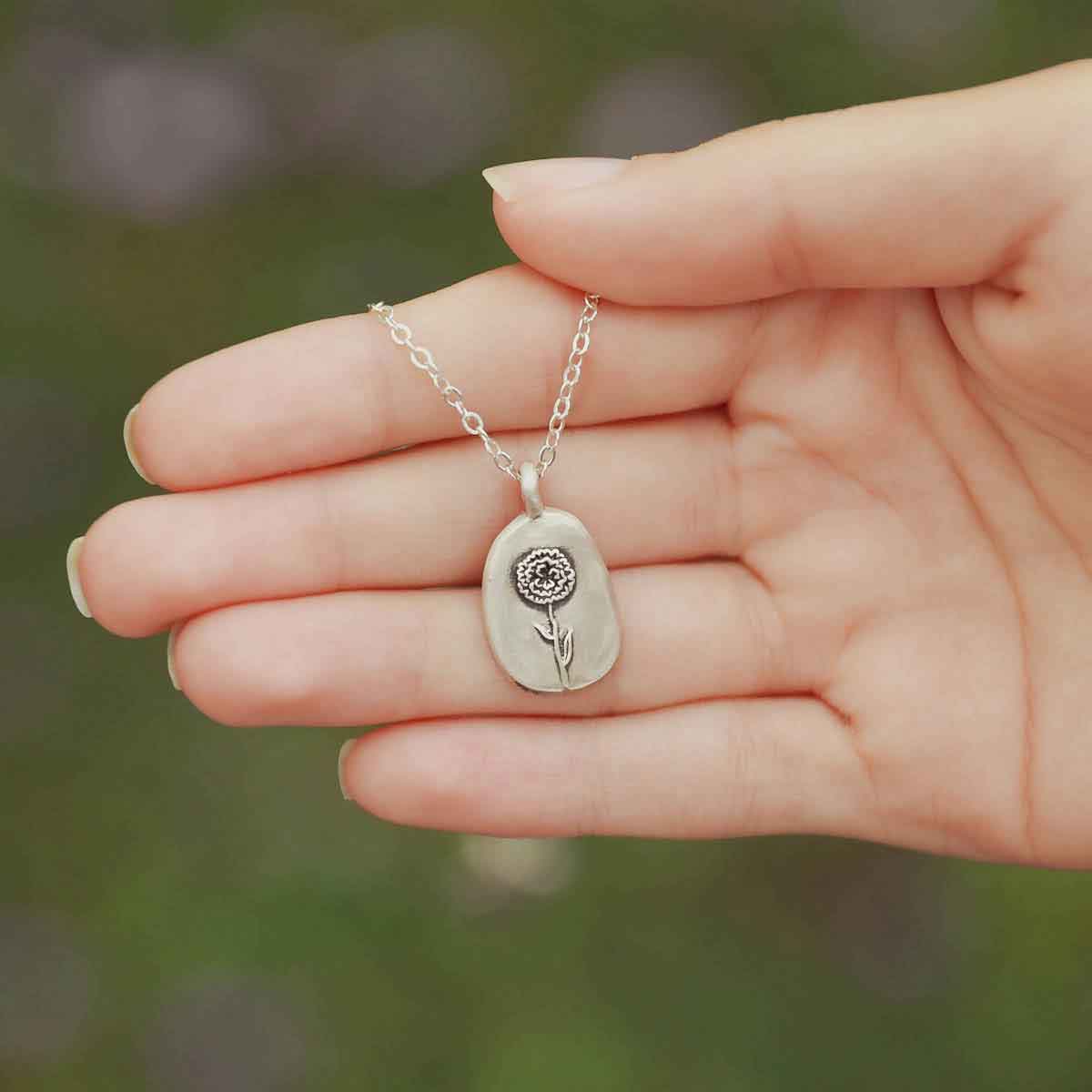 girl wearing a sterling silver January birth flower necklace