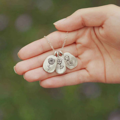 girl wearing a sterling silver January birth flower necklace