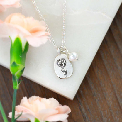 January birth flower necklace handcrafted in sterling silver with a special birth month charm strung with a vintage freshwater pearl