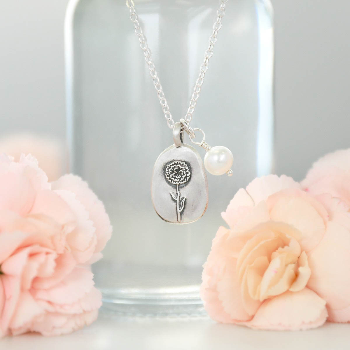 January birth flower necklace handcrafted in sterling silver with a special birth month charm strung with a vintage freshwater pearl