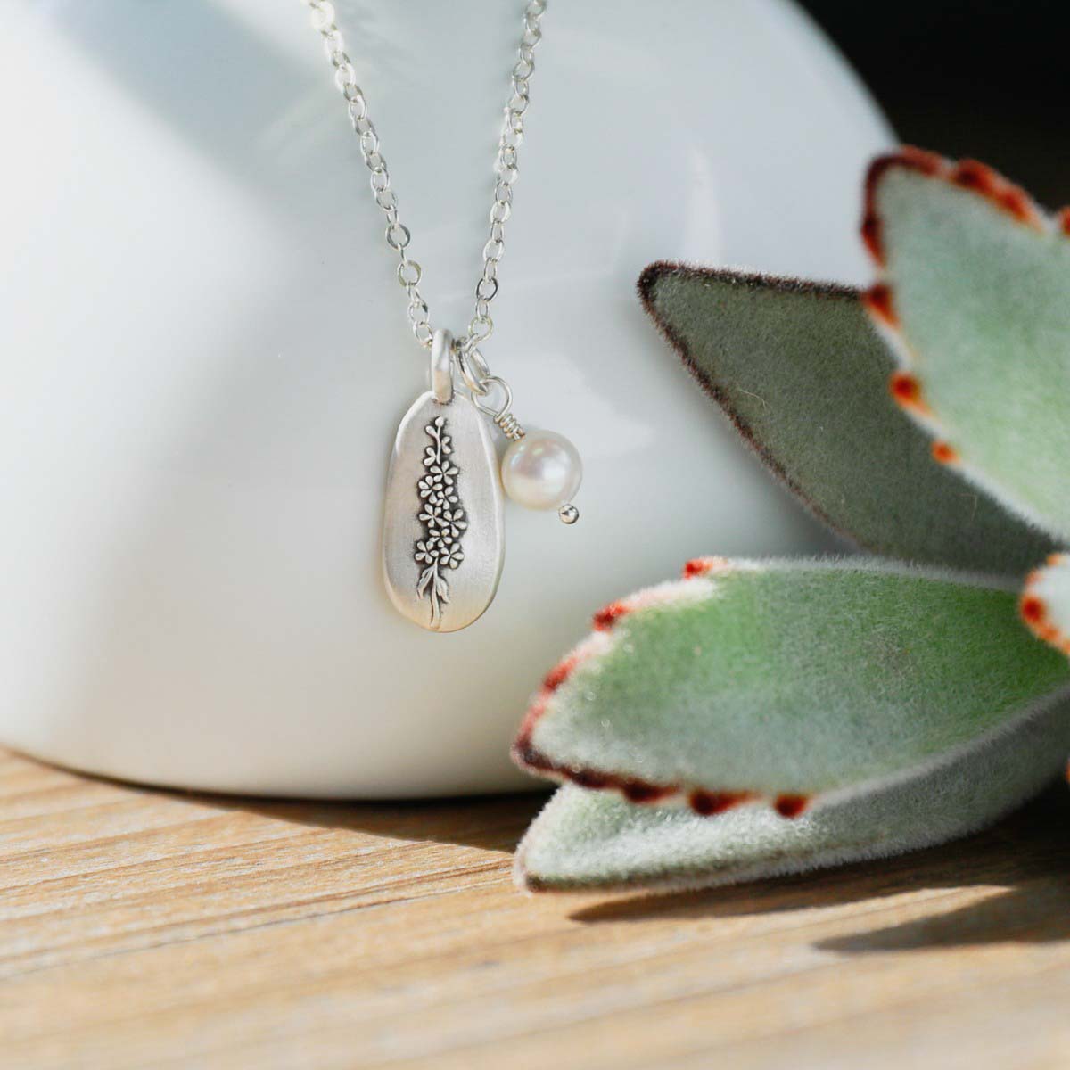 July birth flower necklace handcrafted in sterling silver with a special birth month charm strung with a vintage freshwater pearl