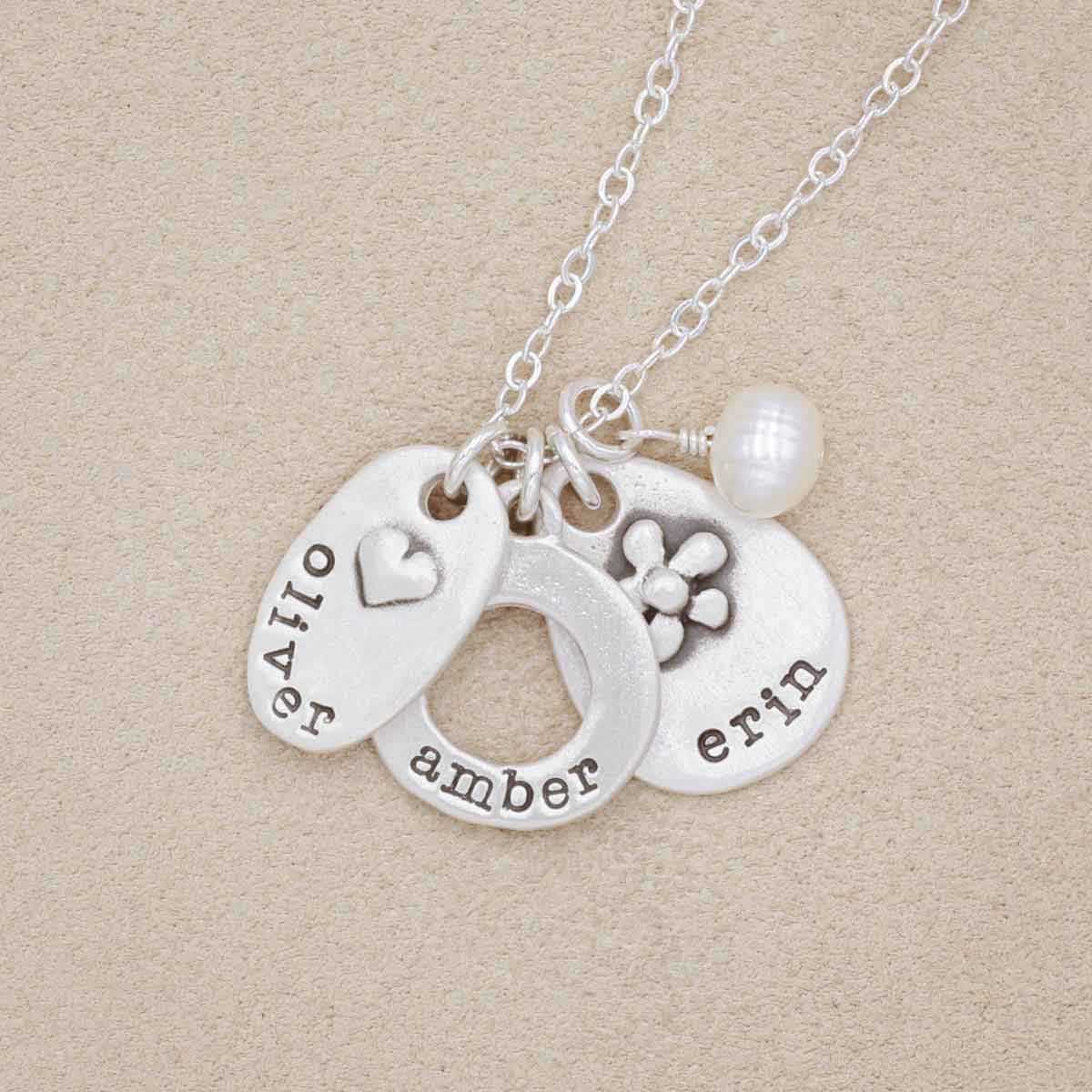 Sterling silver jumble of charms necklace with handcrafted, personalized sterling silver charms