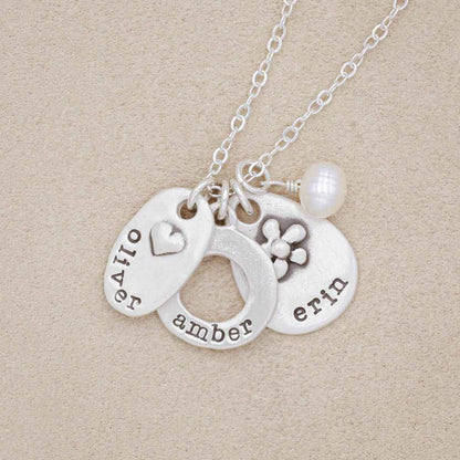 Sterling silver jumble of charms necklace with handcrafted, personalized sterling silver charms