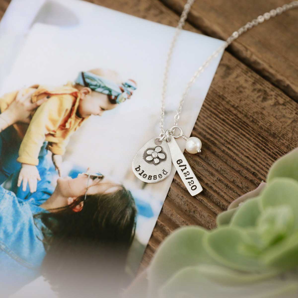  personalized sterling silver charms and strung on silver link chain with a freshwater pearl in original packaging