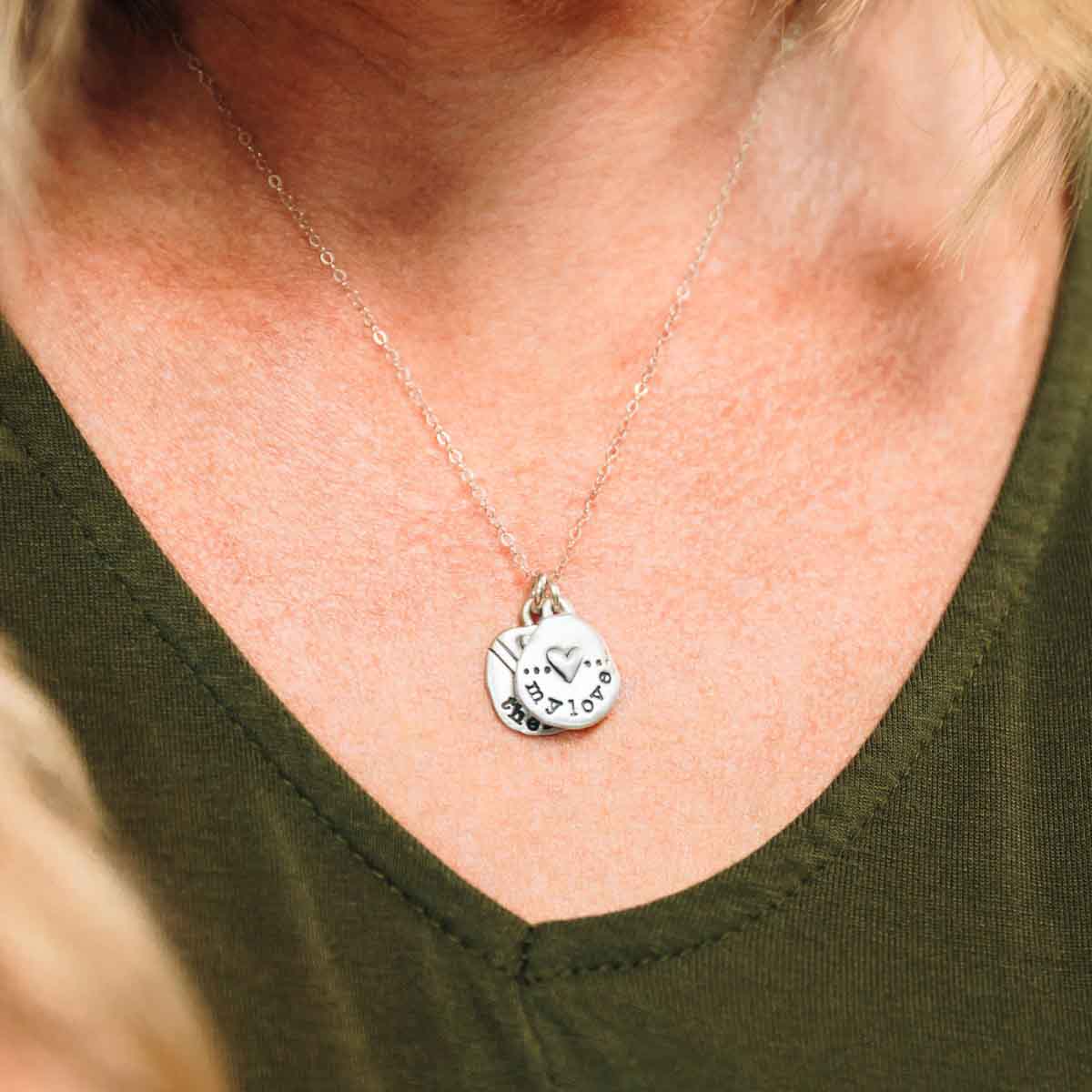 Woman wearing Personalized jumble of love necklace sterling silver