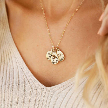 woman wearing her handcrafted 14k yellow gold personalized jumble of love necklace with a gold charm