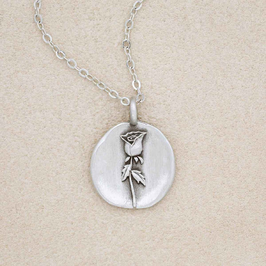 pewter June Birth Flower Necklace with 18" link chain, on beige background