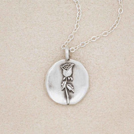 sterling silver June birth flower necklace, on beige background