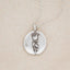 sterling silver June birth flower necklace, on beige background