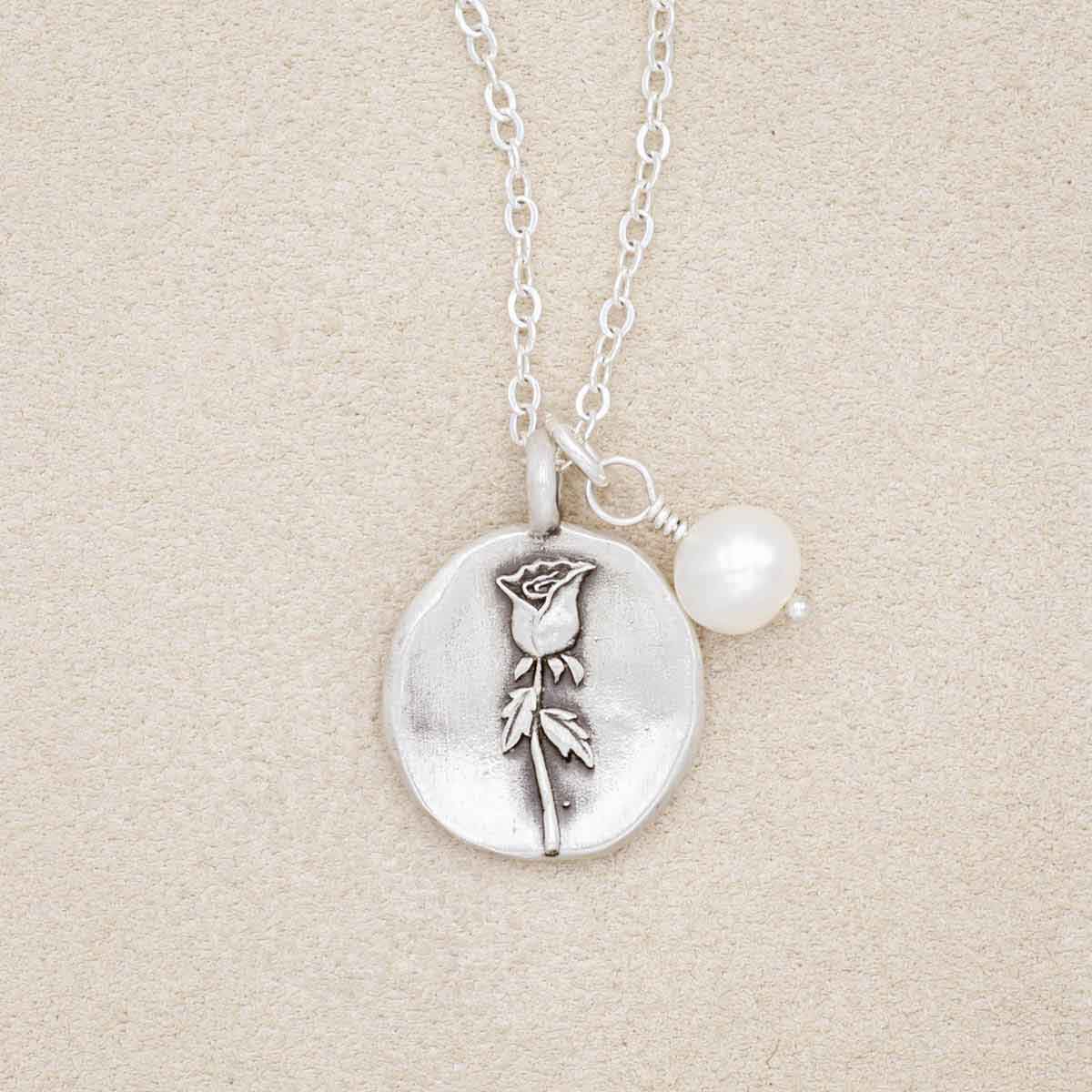 June birth flower necklace handcrafted in sterling silver with a special birth month charm strung with a vintage freshwater pearl