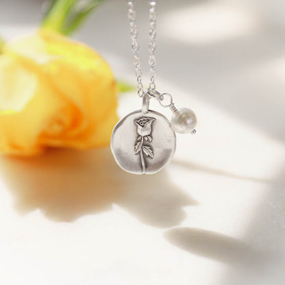 June birth flower necklace handcrafted in sterling silver with a special birth month charm strung with a vintage freshwater pearl