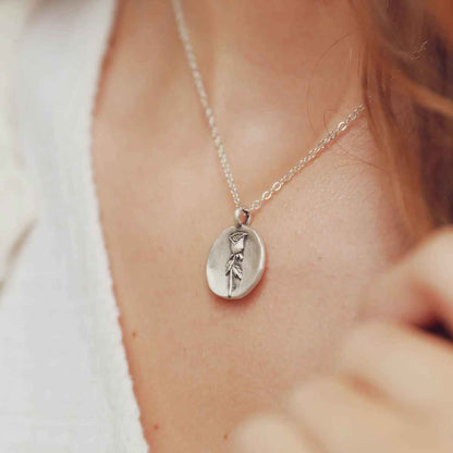 girl wearing a sterling silver June birth flower necklace