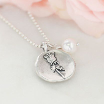 June birth flower necklace handcrafted in sterling silver with a special birth month charm strung with a vintage freshwater pearl