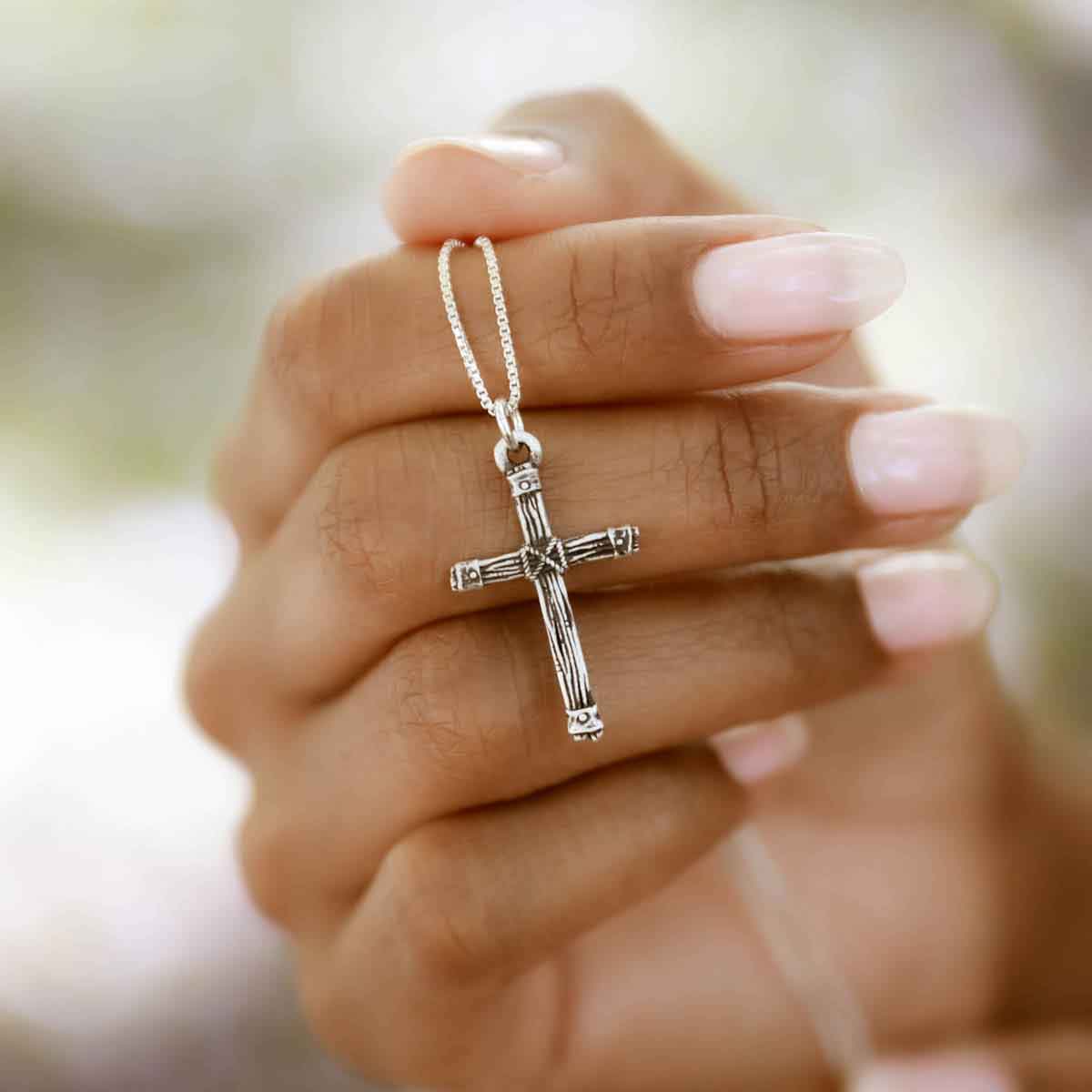 woman wearing a sterling silver Justified Cross Necklace