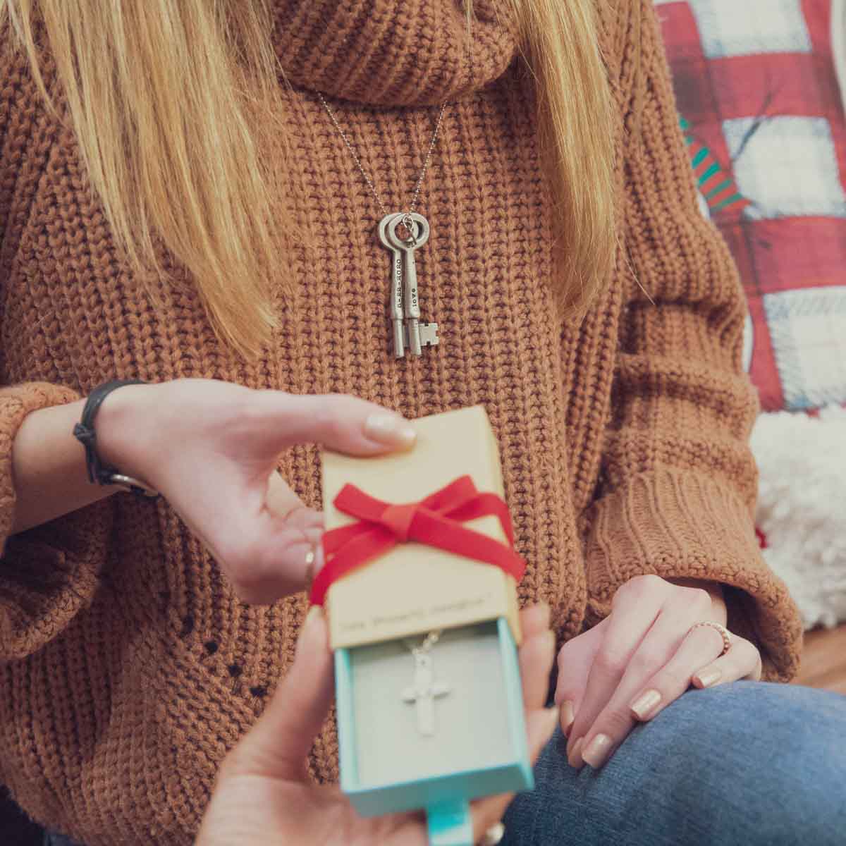 Girl with friends and her Key to my heart necklace handcrafted in pewter with up to three keys customizable with a name