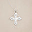 Known and loved cross necklace handcrafted in sterling silver with the cross charm hanging from choice of chain