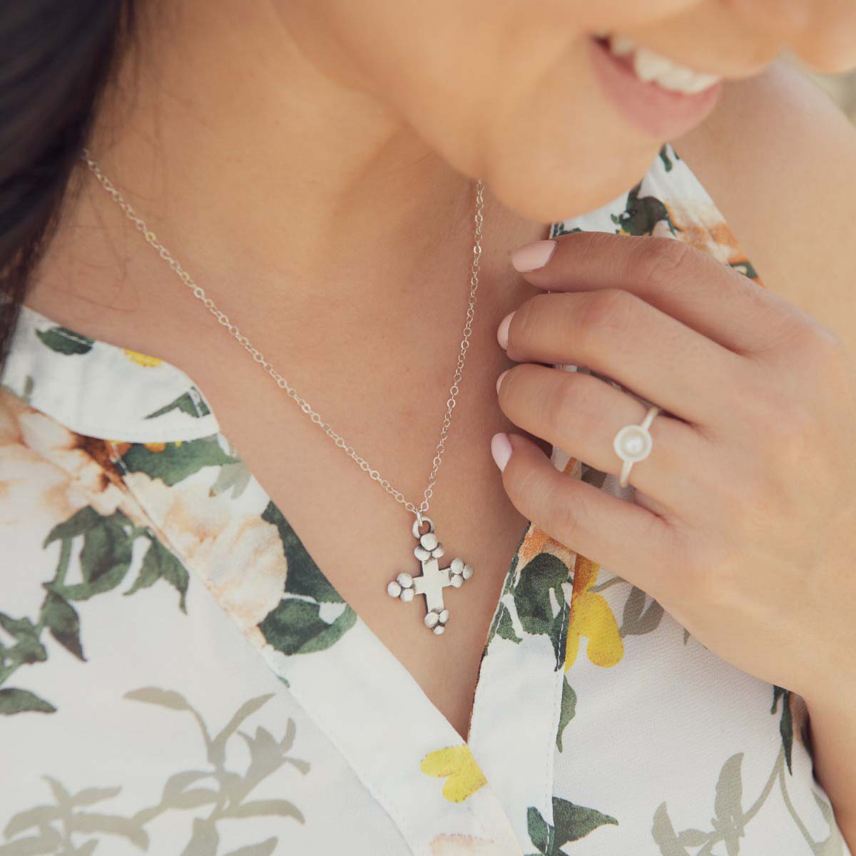 Girl wearing her Known and loved cross necklace handcrafted in sterling silver with the cross charm hanging from choice of chain