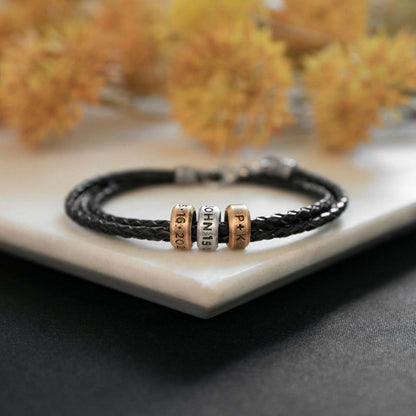 Limitless Leather bracelet handcrafted with black bolo leather cord and choice of personalized sterling silver and bronze limitless rings