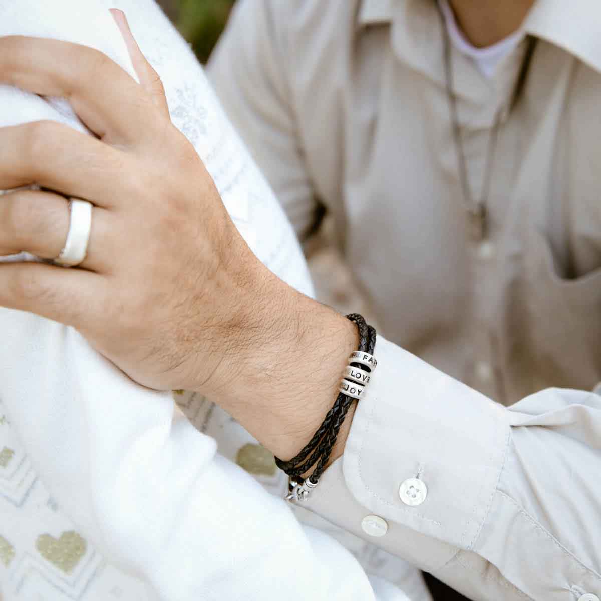 man wearing limitless leather bracelet with girlfriend