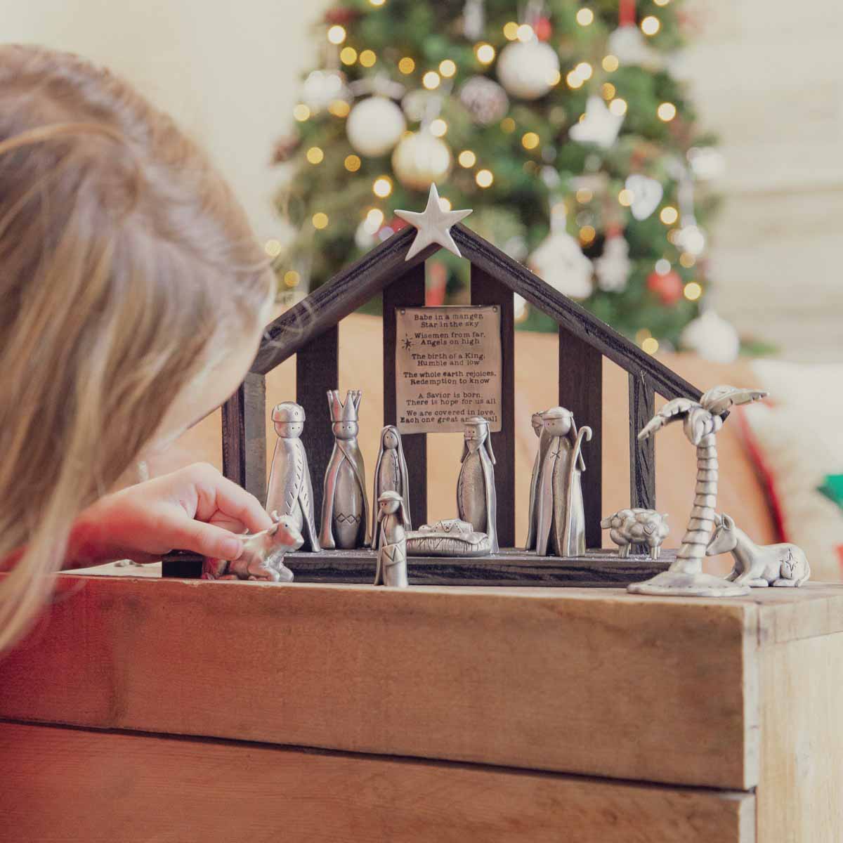 handcrafted little drummer boy and ox pewter figurine set along with other pieces of the nativity set