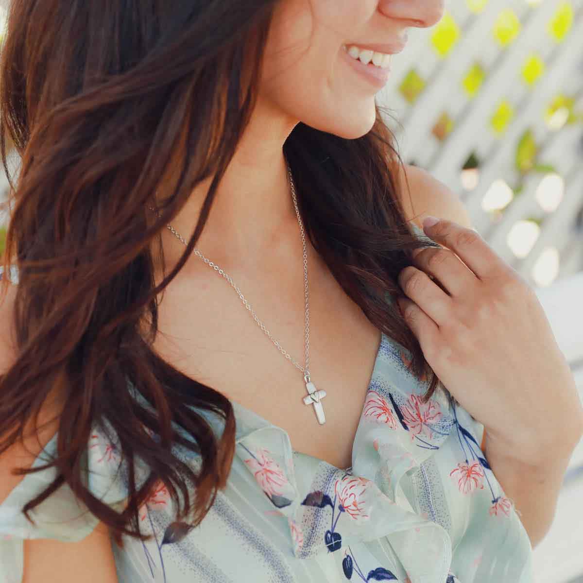 girl wearing sterling silver cross of faith necklace