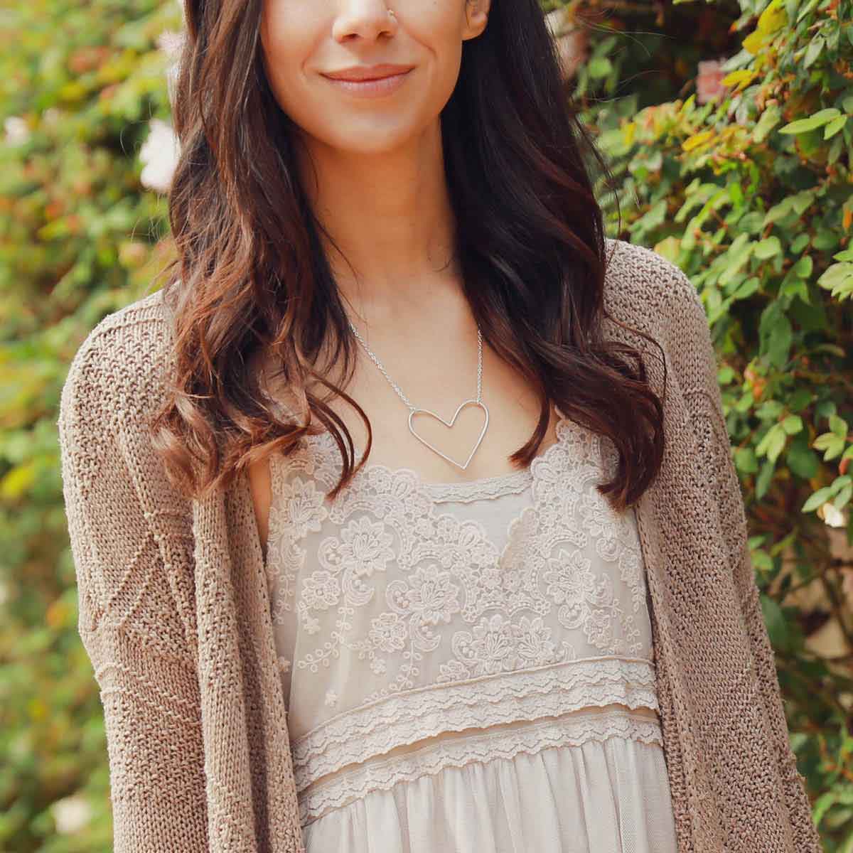 girl wearing a Peaceful Heart Necklace handcrafted in sterling silver