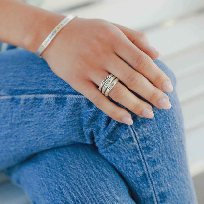 Woman wearing her Personalized sterling silver stackable name rings