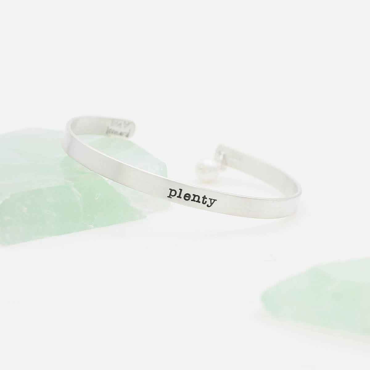 girl wearing personalized sterling silver thin cuff