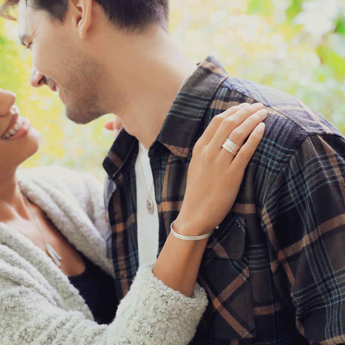 mom wearing the you have my heart spinner ring {sterling silver & 10k gold} holding daughter