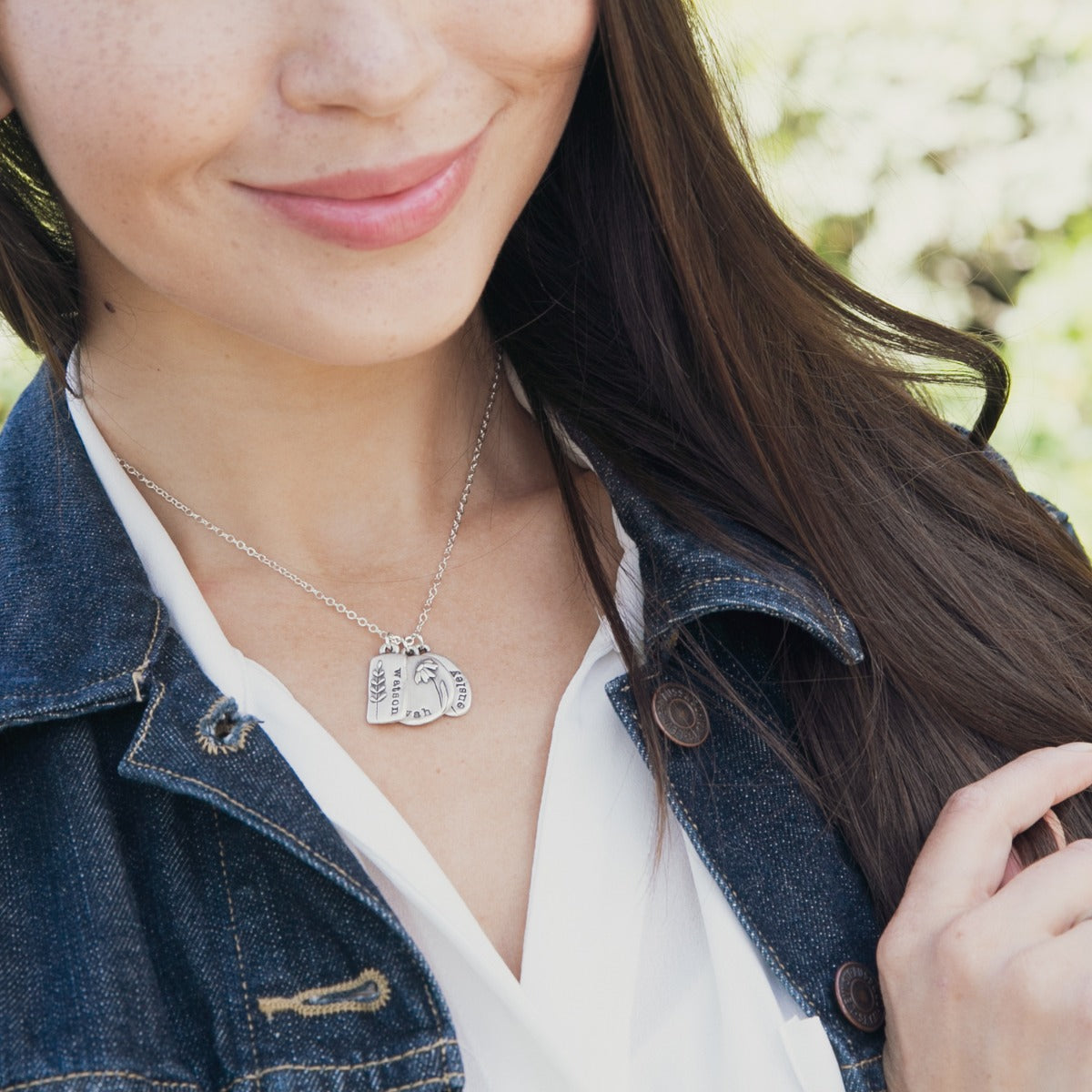 Girl wearing her Personalized sterling silver be you wildflowers necklace 