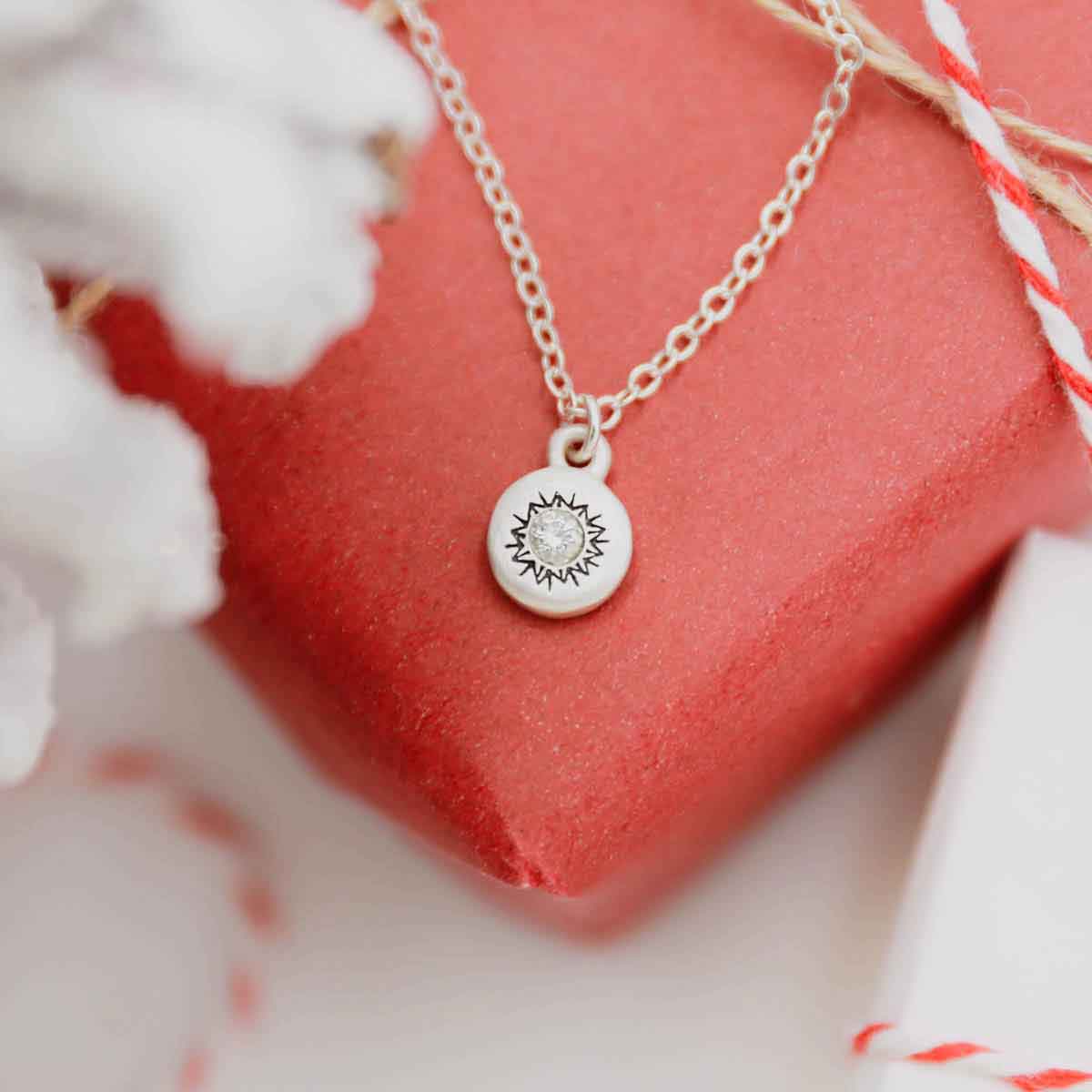 Dainty Sunburst Necklace cast in Sterling Silver and set with a 3mm cubic zirconia stone