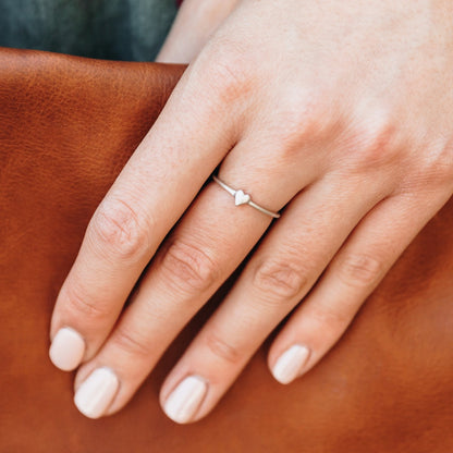 girl wearing a sterling silver sweet love ring - one heart  